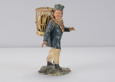 Lot 395 - A mid 19th century Rhöner carved wooden man heading to market