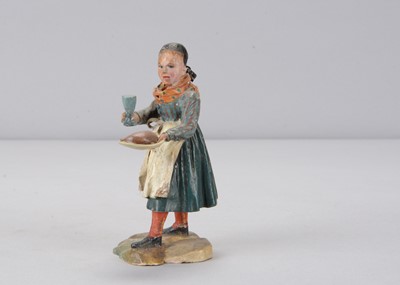 Lot 397 - A mid 19th century Rhöner carved wooden girl waitress