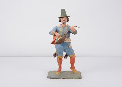 Lot 414 - A mid 19th century Thüringen papier-mâché traveling minstrel nodder