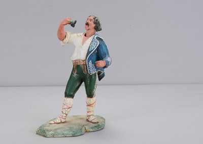 Lot 415 - A mid to late 19th century Thüringen actor or singer eating grapes nodder