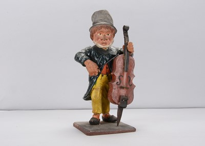 Lot 417 - A large late 19th century Thüringen street cellist nodder