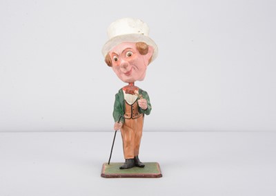 Lot 419 - A mid 19th century German papier-mâché large headed Dandy gentleman nodder