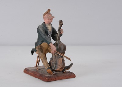 Lot 421 - A mid 19th century Thüringen cellist nodder