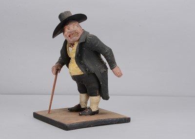 Lot 422 - A mid 19th century Thüringen papier-mâché figure of an angry man match striker