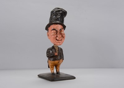 Lot 424 - A large mid to late 19th century Thüringen large headed nodder, probably Dickens’s Mr Micawber