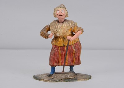 Lot 430 - A mid 19th century Thüringen papier-mâché Old Mother Hubbard nodder