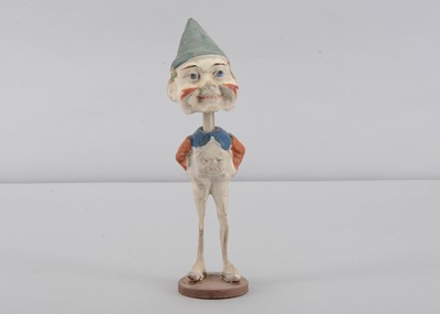 Lot 433 - An early 20th German composition white face clown nodder