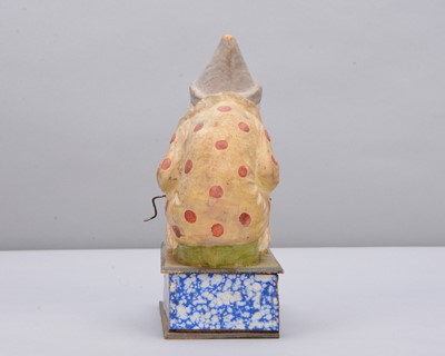 Lot 438 - A late 19th century Thüringen white faced clown eating a pig crank handled ‘eater’