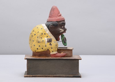 Lot 439 - A late 19th century Thüringen black man clown eating a bug crank handled ‘eater’