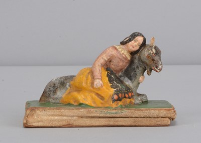 Lot 445 - A mid 19th century Thüringen papier-mâché girl and goat squeak toy