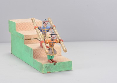 Lot 458 - A mid19th century German mercury Chinese acrobat tumbling toy