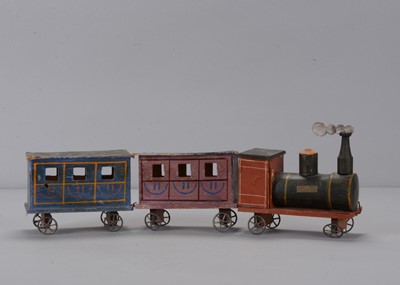 Lot 471 - A late 19th century Erzgebirge wood and cardboard floor train