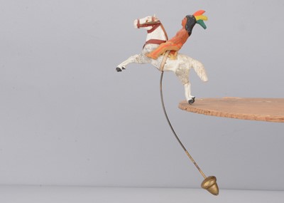 Lot 476 - An early 20th century composition Native American balancing toy