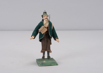 Lot 481 - A mid 19th century Sonneberg huntsman dolls’ house or theatre doll