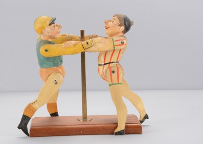 Lot 488 - A late 19th century Albin Amende Sonneberg jockey and clown wrestling toy