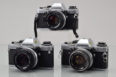 Lot 21 - Three Olympus OM-10 SLR Cameras