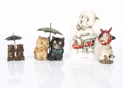 Lot 43 - A Chloe Preston Fifi-type lead googlie eyed cats sat under an umbrella