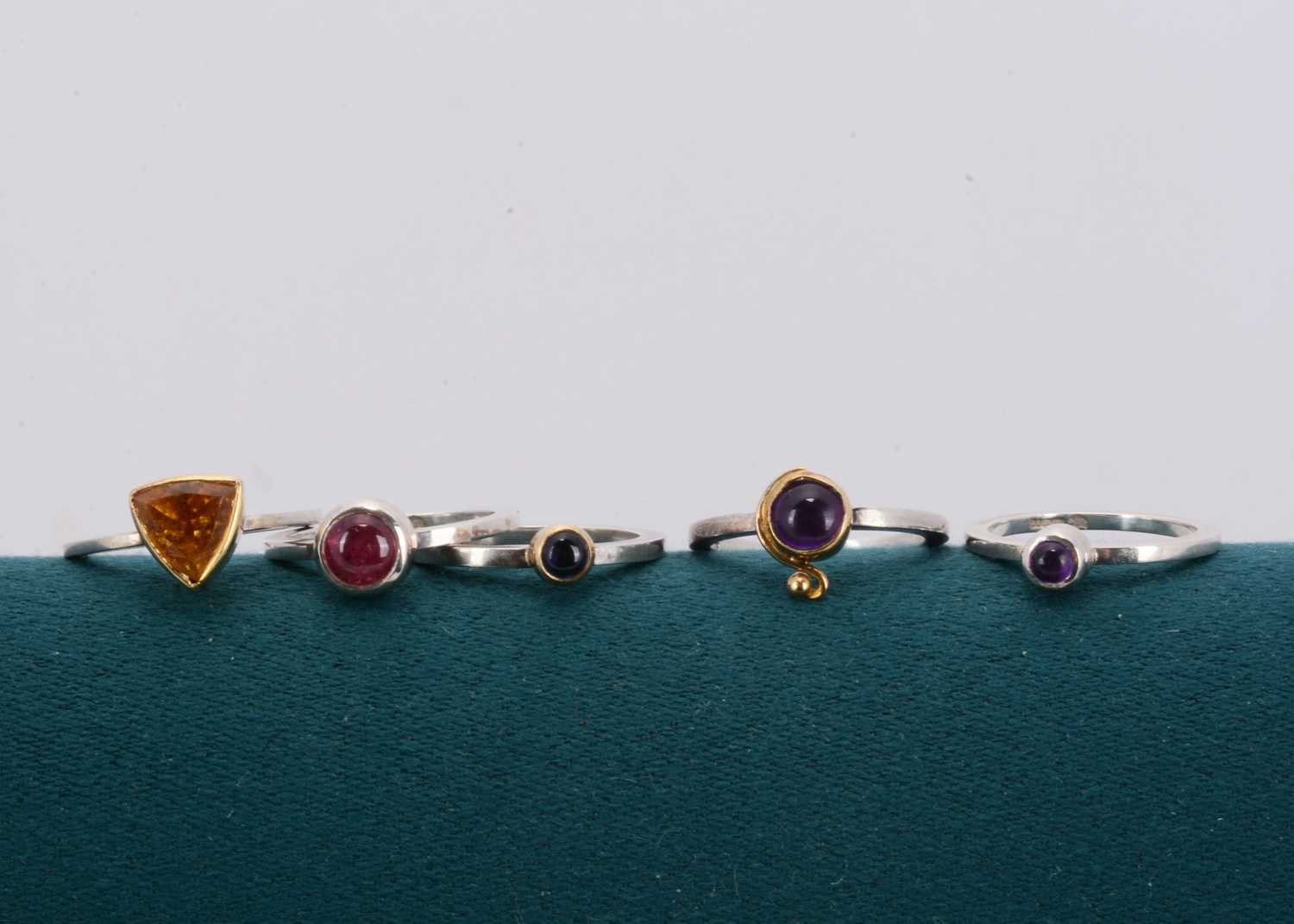 Lot 89 - A set of silver gem set stacking rings