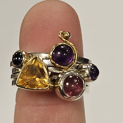 Lot 89 - A set of silver gem set stacking rings