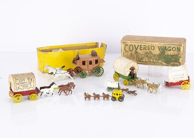 Lot 197 - Golden Age of Cowboys and Indian die-cast covered wagons and stage coach