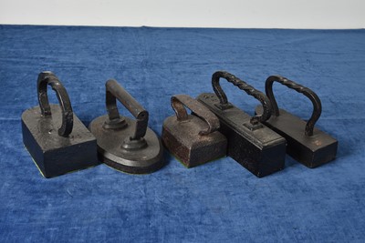 Lot 17 - Five very large/heavy irons