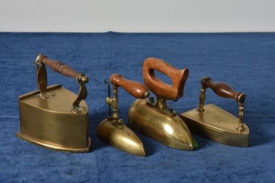 Lot 50 - A group of four Brass Irons