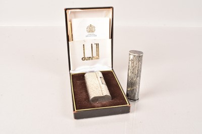 Lot 166 - Two white metal Dunhill Pocket Lighters