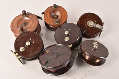 Lot 184 - A small collection of wooden and Bakelite Fishing Reels