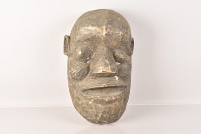 Lot 279 - An African carved wooden Mask