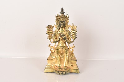 Lot 487 - A Sino-Tibetan gilt bronze of Buddha