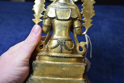 Lot 487 - A Sino-Tibetan gilt bronze of Buddha