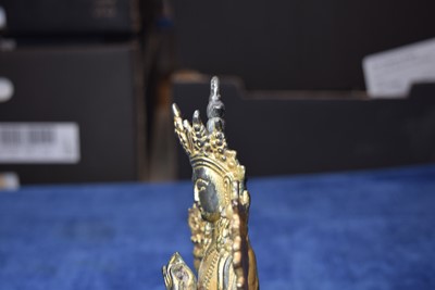 Lot 487 - A Sino-Tibetan gilt bronze of Buddha