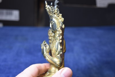 Lot 487 - A Sino-Tibetan gilt bronze of Buddha