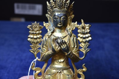 Lot 487 - A Sino-Tibetan gilt bronze of Buddha