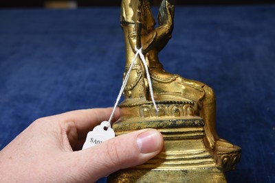 Lot 487 - A Sino-Tibetan gilt bronze of Buddha