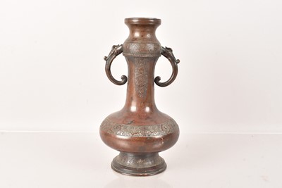 Lot 495 - A Chinese Bronze Twin Handle Vase