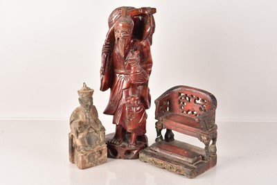 Lot 498 - A Chinese carved wooden figure of a Deity