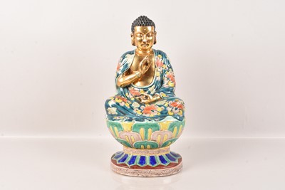 Lot 514 - A Chinese Porcelain Buddha