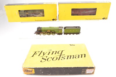 Lot 177 - Trix 00 Gauge yellow boxed metal Britannia and plastic bodied Flying Scotsman and Western Diesel (3)