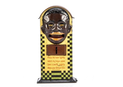 Lot 312 - A Saalheimer & Strauss for Lyons Tea black man tinplate money bank 1920s