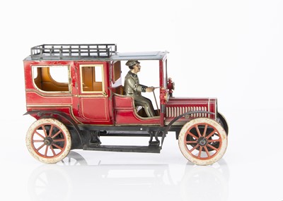 Lot 314 - A George Carette clockwork lithographed tinplate Landaulette toy automobile circa 1910
