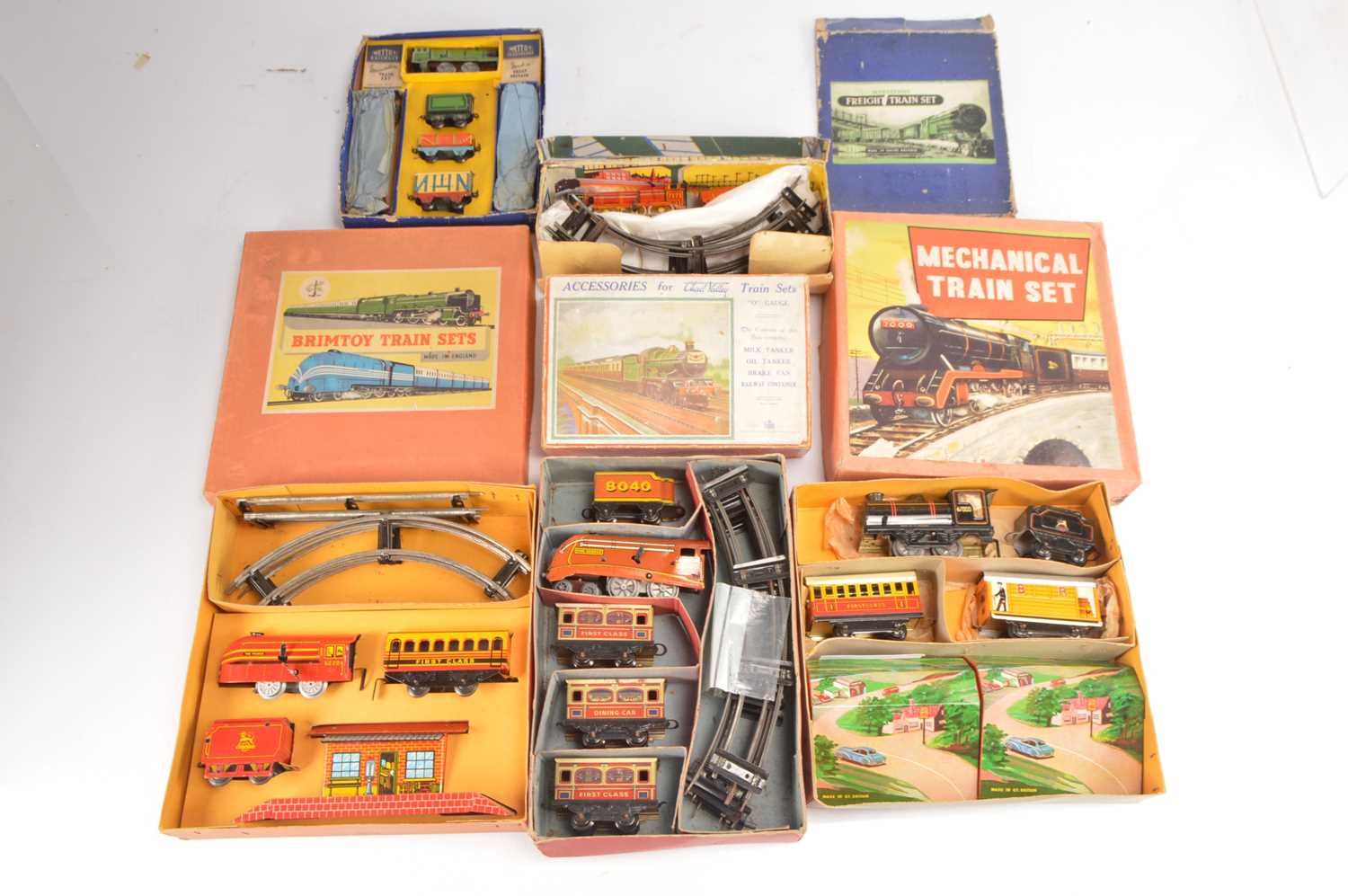 Lot 703 - Brimtoy Chad Valley Mettoy and other lesser manufacturers 00 and 0 Gauge tinplate clockwork Train Sets and Accessories (5)