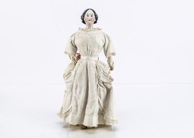 Lot 257 - A fine German mid 19th century china shoulder-head doll with elaborate hair