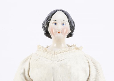 Lot 257 - A fine German mid 19th century china shoulder-head doll with elaborate hair