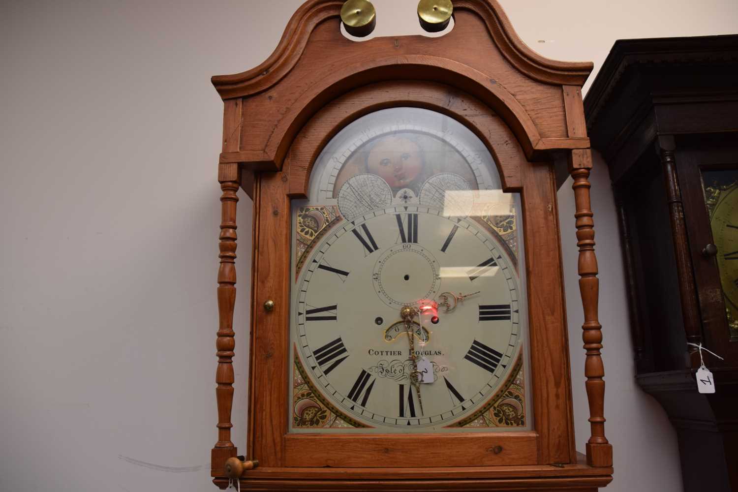 Lot 1 - An early 19th century and later pine long cased clock