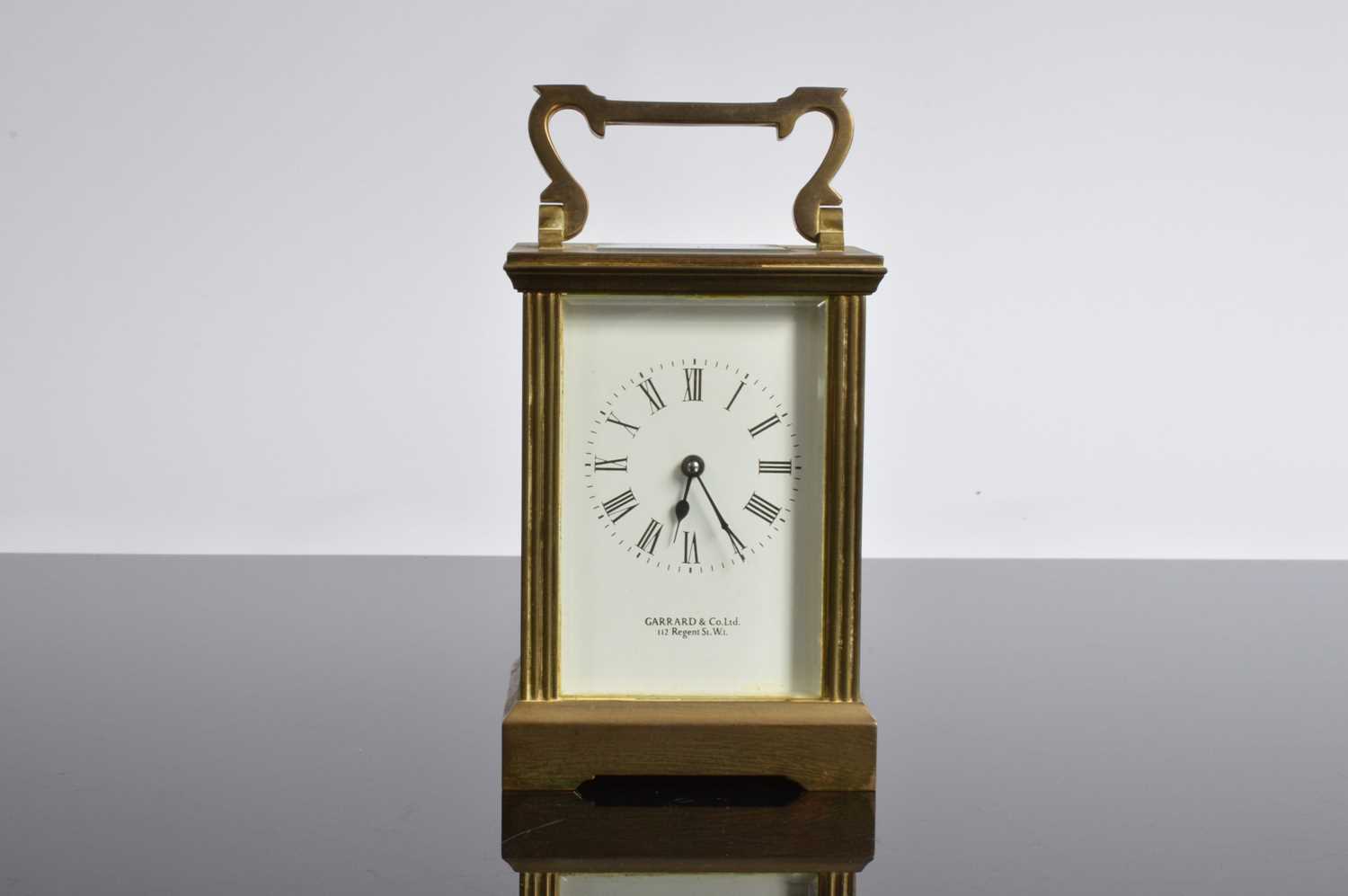 Lot 17 - A vintage brass carriage timepiece from Garrard & Co
