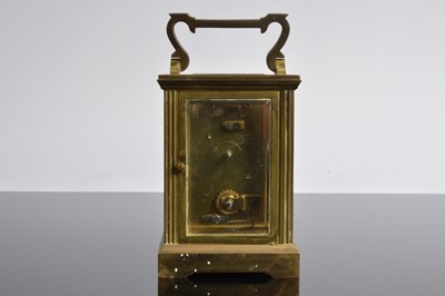 Lot 17 - A vintage brass carriage timepiece from Garrard & Co