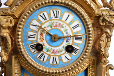 Lot 24 - A 19th century French Louis XVI style brass and porcelain mounted mantle clock