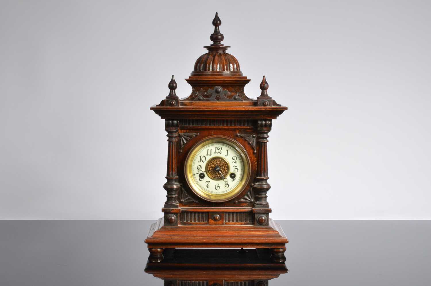 Lot 28 - A late 19th century German carved wooden mantle clock