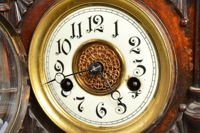 Lot 28 - A late 19th century German carved wooden mantle clock